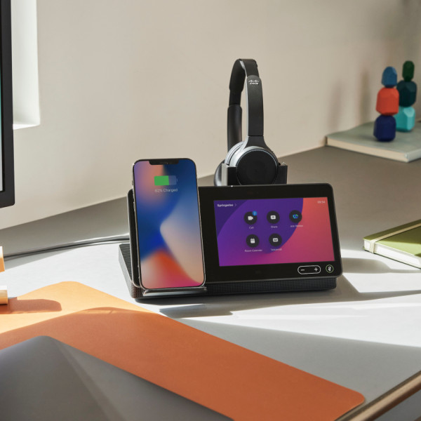 The Webex Desk Hub sits on a desk in an office.