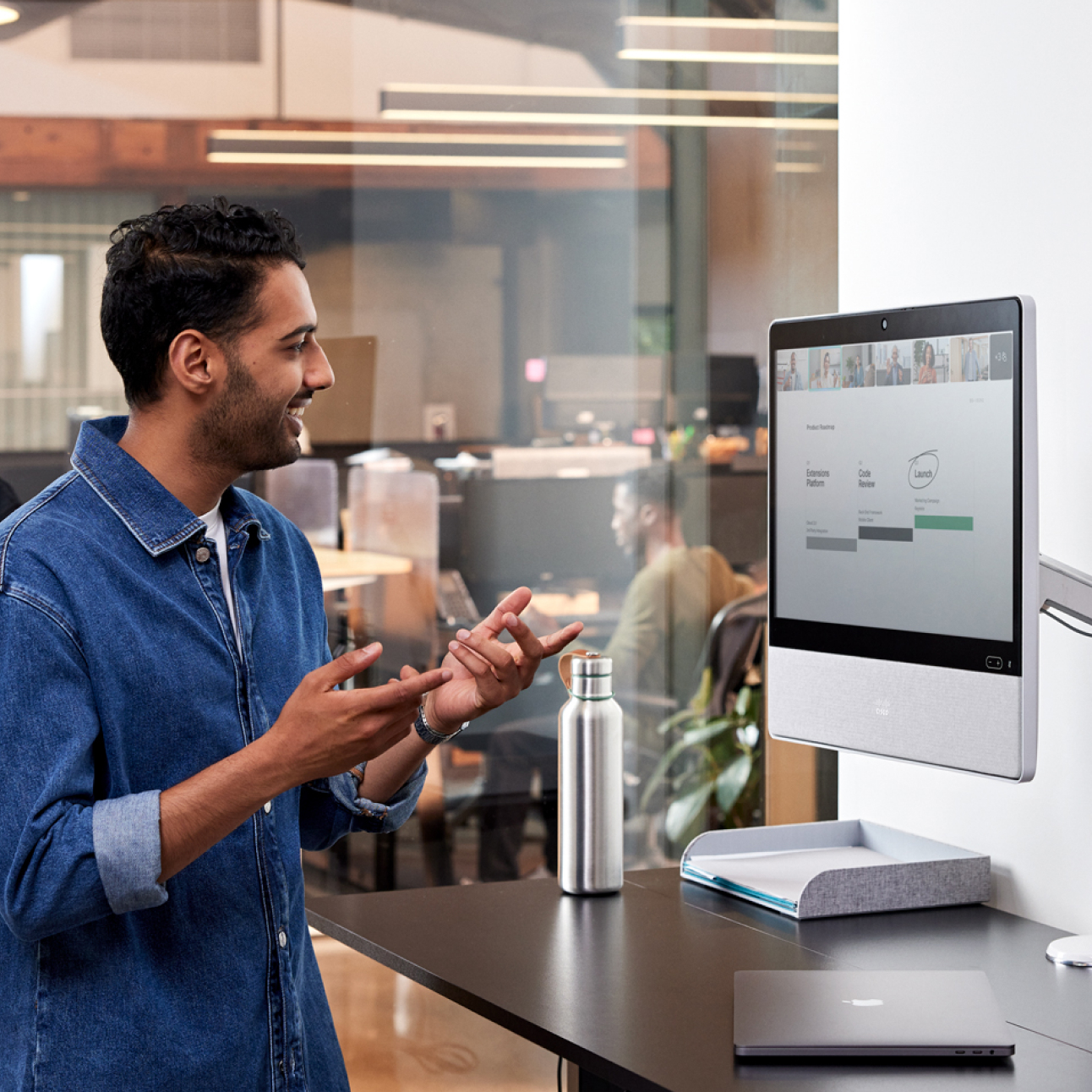 Person in an office engaging in a digital whiteboarding video conference call using Webex Meetings