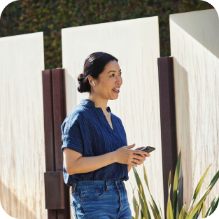 person outside using a mobile device to have a conversation