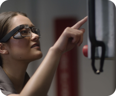 A frontline worker completes a task, leveraging Webex Expert on Demand and wearing a Glass headset, developed by Google.