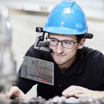 A frontline worker in a RealWear Headset leverages Webex Expert on Demand to complete a task.