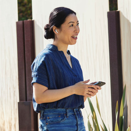 Person outside having a voice call on mobile device